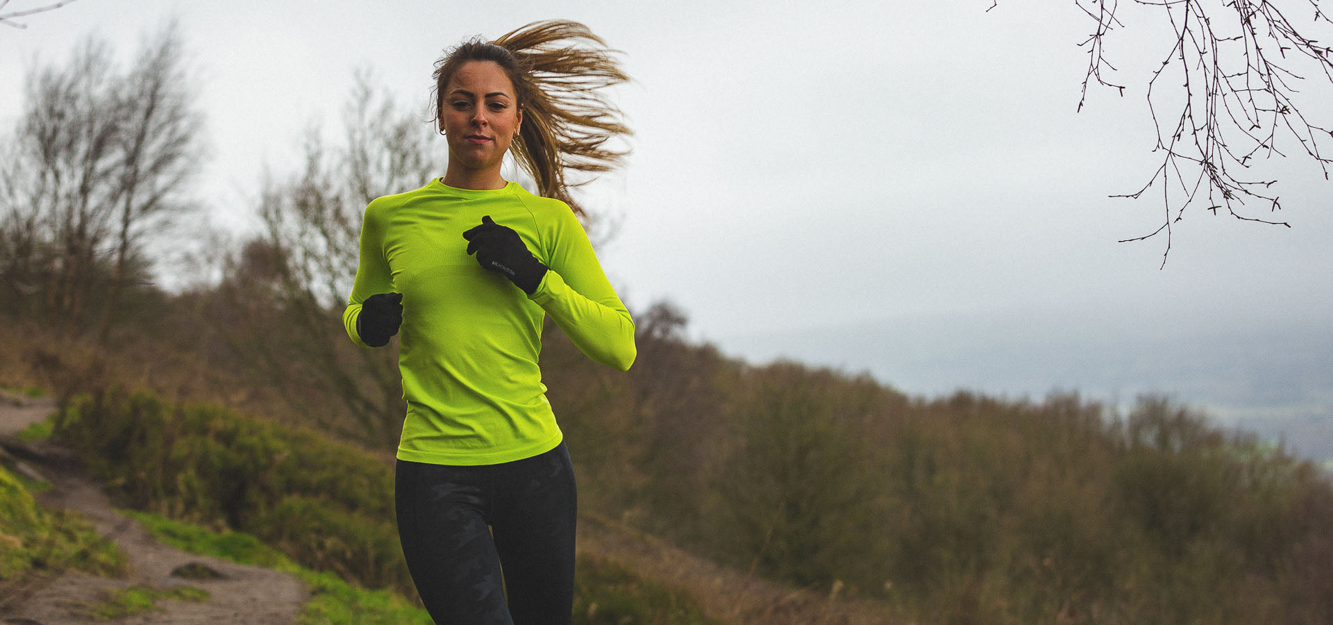 Woman runs in base layer
