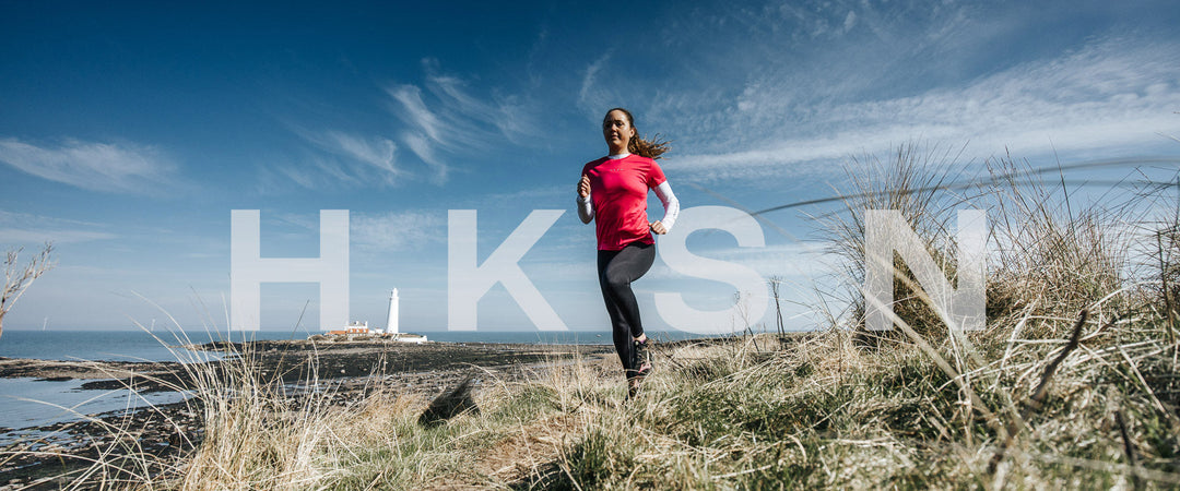 Lady runs through dunes