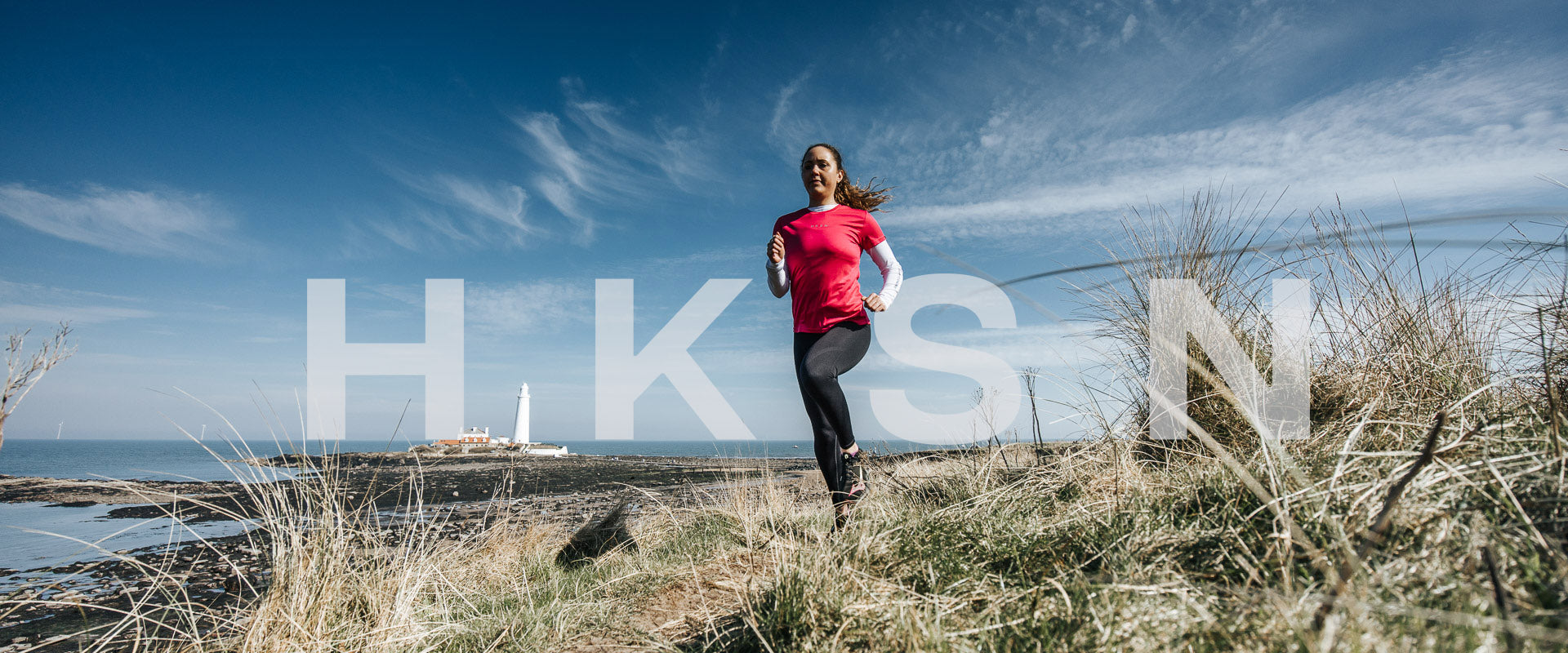 Lady runs through dunes